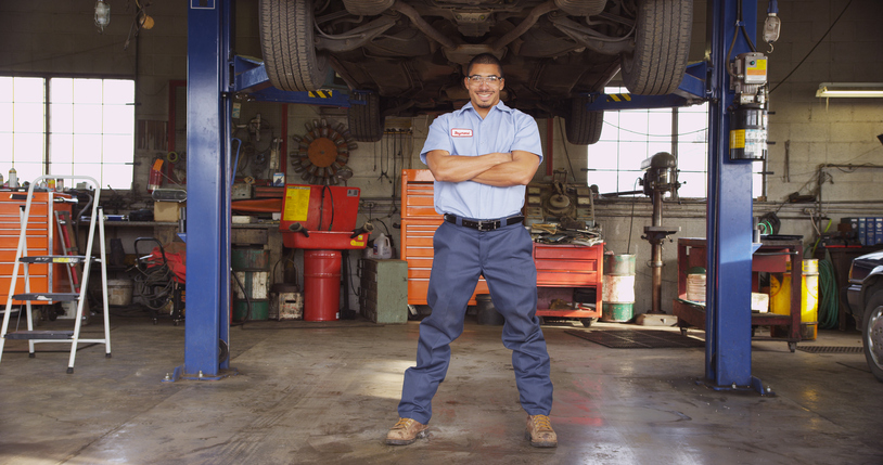 A mechanic in a large repair shop