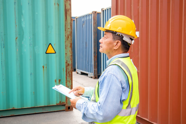A load planner inspecting cargo after dispatch training
