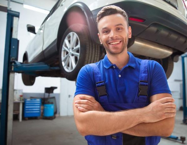 Auto mechanic in a repair shop after auto mechanic school