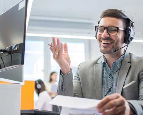 Dispatch Training Graduate communicating telephonically with a driver
