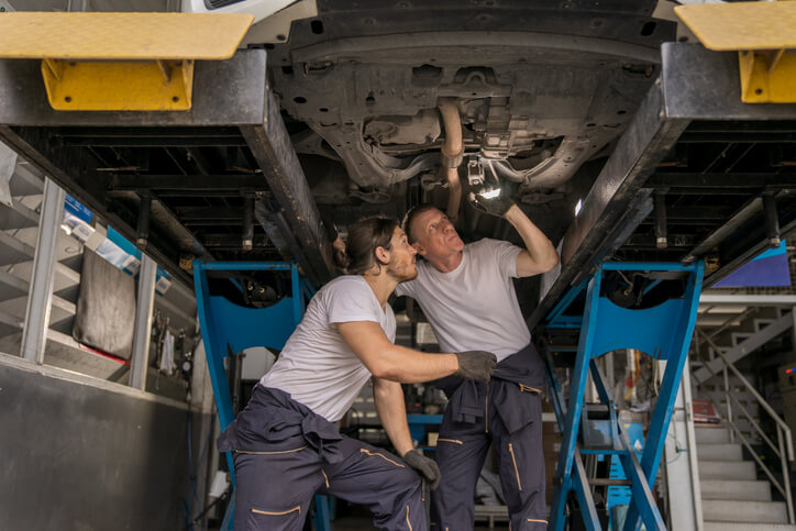 Diesel mechanic training student learning under supervisor