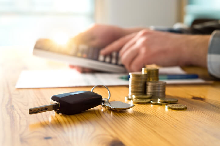 automotive school student counting money on a table