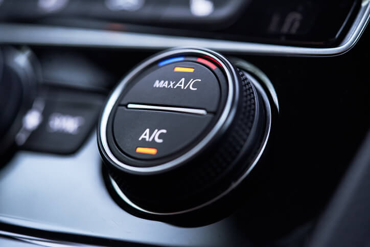 A/C button in a car as seen by students in automotive air conditioning training