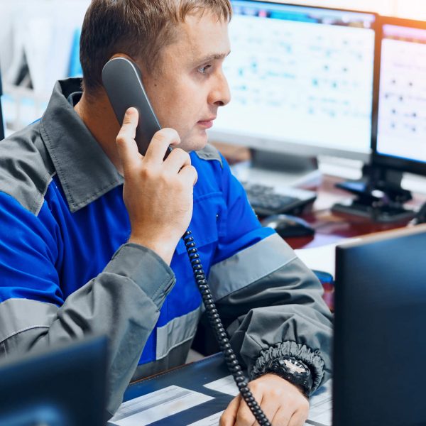 A male taxi dispatcher at work after automotive training