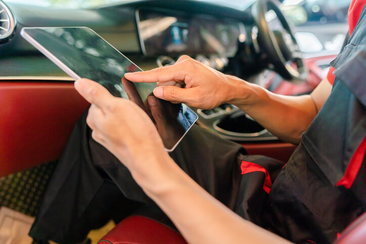 A car mechanic applying a software update