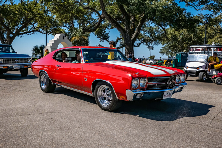 Restored red Chevrolet Chevelle SS muscle car, highlighting opportunities in auto mechanic training to combine classic restoration with electric vehicle technology.