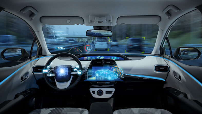A self-driving car equipped with sensors, cameras, and radar systems used in modern auto mechanic training.