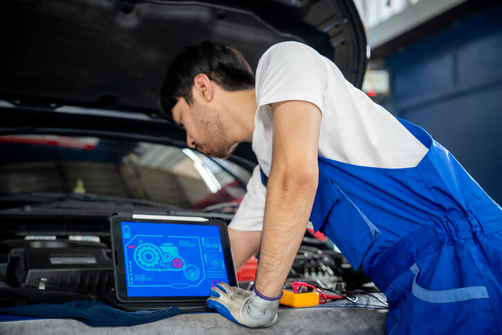 An automotive student diagnosing an engine misfire using scan tool data