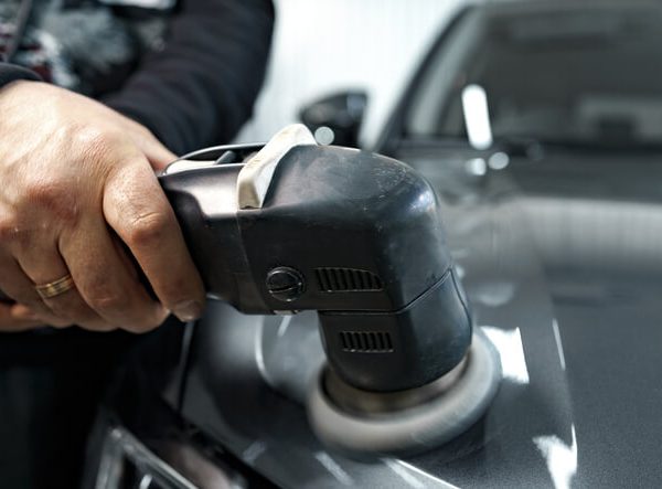 A professional car detailing exterior polishing process