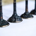 A row of Intake valves with heavy carbon buildup in a direct-injection engine