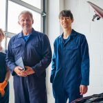 A new apprentice working alongside a senior technician during a mechanic apprenticeship training