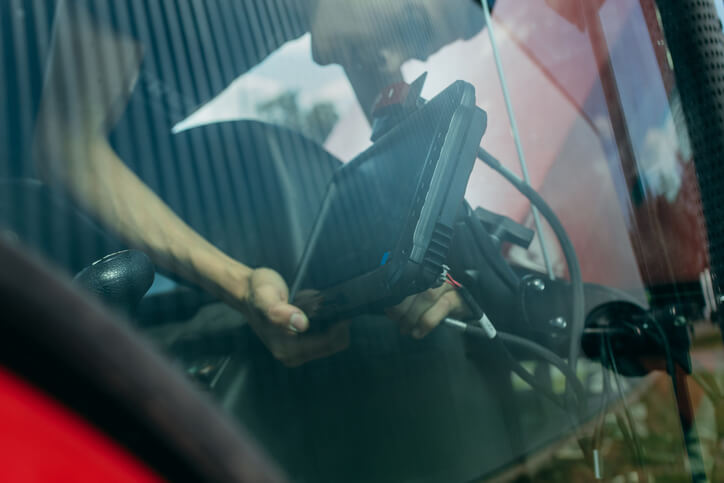 A technician analyzing CAN bus communication data on a modern vehicle