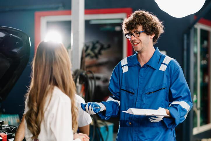 An automotive student learning customer communication and repair documentation skills.