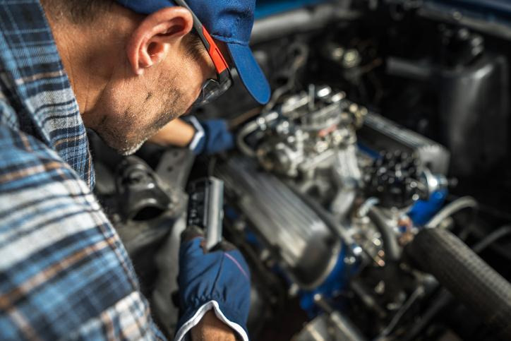 An automotive technician investigating EGR valve symptoms in an engine