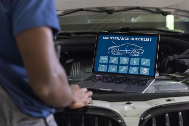 An automotive student diagnosing a vehicle that stalls at an intersection
