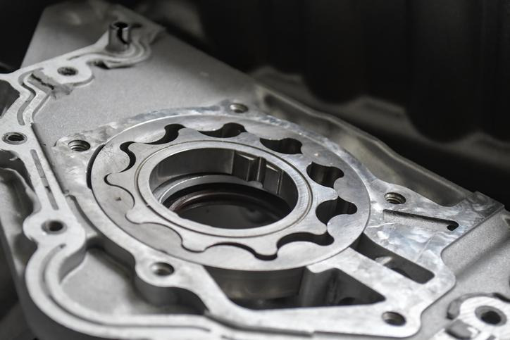 A close-up of a variable displacement oil pump and its internal components