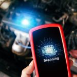 A student diagnosing a camshaft position sensor problem with a scan tool